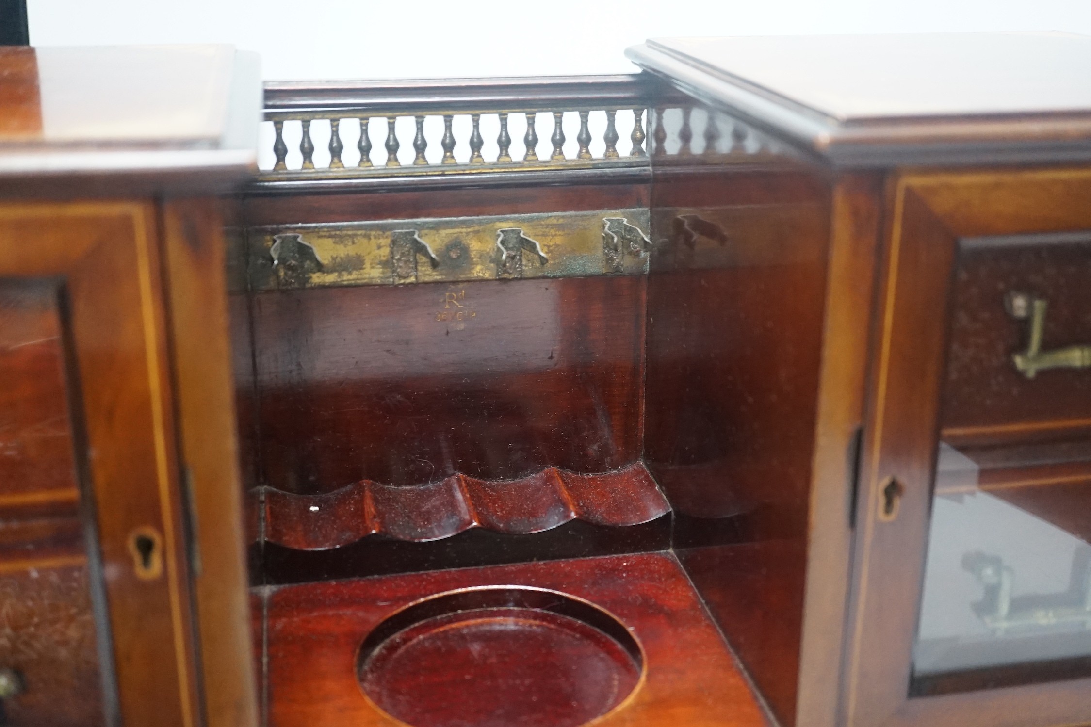 An Edwardian inlaid mahogany smoker's compendium with Doulton Lambeth stoneware tobacco jar, 52cm wide